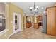 Open-concept kitchen area with stainless steel appliances and access to the outdoor living space at 16102 Colchester Palms Dr, Tampa, FL 33647
