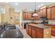 Updated kitchen with an island, stainless steel appliances, granite countertops, and custom wood cabinets at 16102 Colchester Palms Dr, Tampa, FL 33647