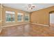 Expansive living room with large windows offering views of the lush outdoor surroundings at 16102 Colchester Palms Dr, Tampa, FL 33647
