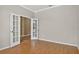 Home office featuring hardwood floors, neutral paint and double doors at 16102 Colchester Palms Dr, Tampa, FL 33647