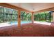 Covered patio overlooks a screened pool, creating a perfect spot for relaxation and entertainment at 16102 Colchester Palms Dr, Tampa, FL 33647