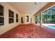 Covered patio next to a screened pool, provides an excellent setting for outdoor relaxation at 16102 Colchester Palms Dr, Tampa, FL 33647