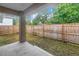 Spacious backyard featuring a concrete patio and wood fence surrounding the property at 1717 Preston S St, St Petersburg, FL 33712