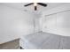 This bedroom features light wood floors, a ceiling fan, and a window at 1717 Preston S St, St Petersburg, FL 33712