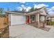 Charming home featuring a single car garage, bright red door and an easy to maintain front yard at 1717 Preston S St, St Petersburg, FL 33712
