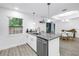 Kitchen featuring granite counters, a stainless steel dishwasher, and a view of the dining area at 1717 Preston S St, St Petersburg, FL 33712
