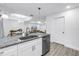 Open kitchen featuring a breakfast bar, stainless steel appliances, and modern finishes at 1717 Preston S St, St Petersburg, FL 33712