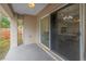 Covered patio area with sliding glass doors offering views into the home's interior at 1717 Preston S St, St Petersburg, FL 33712