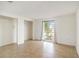 Bedroom with tile floor, large window with view, and closet features creates a bright, airy space at 1741 Font Ln, Holiday, FL 34691