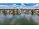 A waterfront community showcases beautiful homes and docks along calm, clear water, ideal for boating enthusiasts at 17715 Wall Cir, Redington Shores, FL 33708