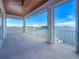 Waterfront balcony with a wood ceiling and tile floor offers stunning views at 17715 Wall Cir, Redington Shores, FL 33708
