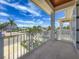 Exterior balcony with white columns and railing, providing an open-air view at 17715 Wall Cir, Redington Shores, FL 33708