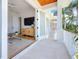 Balcony access to the living room offers an open floor plan with bright lighting at 17715 Wall Cir, Redington Shores, FL 33708