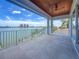 Expansive outdoor balcony featuring beautiful wood ceiling, with stunning waterfront views and ample space at 17715 Wall Cir, Redington Shores, FL 33708