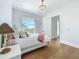 Serene bedroom with natural light, balcony view, and cozy decor at 17715 Wall Cir, Redington Shores, FL 33708