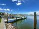 Boat dock with a boat lift offering direct access to the water at 17715 Wall Cir, Redington Shores, FL 33708