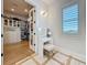 A well-lit dressing area featuring a vanity and access to a spacious walk-in closet at 17715 Wall Cir, Redington Shores, FL 33708
