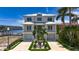 Stunning two-story home with manicured lawn and a three car garage at 17715 Wall Cir, Redington Shores, FL 33708