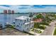 Stunning waterfront home with a metal roof, lush landscaping, and a private boat dock at 17715 Wall Cir, Redington Shores, FL 33708