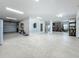 Spacious garage with ample storage space and bright lighting, perfect for organizing tools and equipment at 17715 Wall Cir, Redington Shores, FL 33708