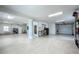 Large garage space featuring ample storage, utility sink, and access to home/outside at 17715 Wall Cir, Redington Shores, FL 33708