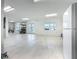 Spacious garage with epoxy floors, storage solutions, and natural light with beautiful canal views at 17715 Wall Cir, Redington Shores, FL 33708