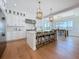 Modern kitchen with pendant lighting, stainless steel appliances, and an island with barstools at 17715 Wall Cir, Redington Shores, FL 33708