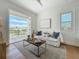 Cozy living room with balcony access, comfortable seating, and natural light at 17715 Wall Cir, Redington Shores, FL 33708