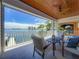 Comfortable outdoor patio with views of the waterfront, featuring cozy seating and stylish decor at 17715 Wall Cir, Redington Shores, FL 33708