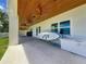 Covered back patio perfect for outdoor entertaining with waterfront views at 17715 Wall Cir, Redington Shores, FL 33708