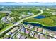 Stunning aerial view showcasing the community's proximity to nature, lakes, and roadways at 2120 Gwynhurst Blvd, Wesley Chapel, FL 33543