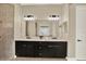 Bathroom featuring double sinks with quartz countertops, and a walk-in shower at 2120 Gwynhurst Blvd, Wesley Chapel, FL 33543