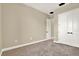 Bright bedroom with soft carpet, neutral walls, and closet with modern doors at 2120 Gwynhurst Blvd, Wesley Chapel, FL 33543