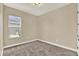 Bedroom with carpet, natural light from the window, and a neutral color palette at 2120 Gwynhurst Blvd, Wesley Chapel, FL 33543