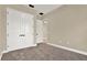 Bright bedroom with soft carpet, neutral walls, and closet with modern doors at 2120 Gwynhurst Blvd, Wesley Chapel, FL 33543