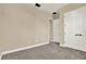 Spacious bedroom with soft carpet, neutral walls, and closet with modern doors at 2120 Gwynhurst Blvd, Wesley Chapel, FL 33543