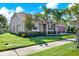 Charming home with stone accents, lush lawn, beautiful landscaping, and a two-car garage at 2120 Gwynhurst Blvd, Wesley Chapel, FL 33543