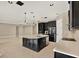 Large kitchen featuring an island with seating, tile floors and a breakfast bar at 2120 Gwynhurst Blvd, Wesley Chapel, FL 33543