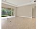 Living room with tile flooring, neutral paint, and access to the outdoors at 2120 Gwynhurst Blvd, Wesley Chapel, FL 33543