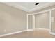 Bright office space with neutral walls, tile floors, and modern doors, perfect for a home-based business or study area at 2120 Gwynhurst Blvd, Wesley Chapel, FL 33543
