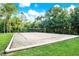 View of the community volleyball court that features a sand base and surrounding green space at 2120 Gwynhurst Blvd, Wesley Chapel, FL 33543