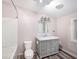 This bathroom features a single sink vanity, woodgrain vinyl floors and a shower/tub combo at 2121 Odessa Gardens Ln, Odessa, FL 33556