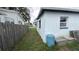 Backyard with fence, a blue barrel, and tool boxes at 2410 38Th N Ave, St Petersburg, FL 33713