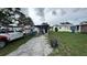 Backyard view featuring some outdoor seating and a parked truck and a power washer at 2410 38Th N Ave, St Petersburg, FL 33713