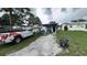 View of the backyard with some outdoor seating and a parked truck at 2410 38Th N Ave, St Petersburg, FL 33713