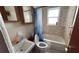 Bathroom features a shower with tub, sink, and window at 2410 38Th N Ave, St Petersburg, FL 33713