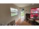 This bedroom features a window for natural light, laminate flooring, and exterior access at 2410 38Th N Ave, St Petersburg, FL 33713
