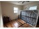 This bedroom features wood-look flooring, a ceiling fan and windows providing natural light at 2410 38Th N Ave, St Petersburg, FL 33713