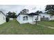 View of a single story home featuring a covered porch and small front yard at 2410 38Th N Ave, St Petersburg, FL 33713