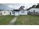 Modest single story home featuring a covered porch and small front yard at 2410 38Th N Ave, St Petersburg, FL 33713